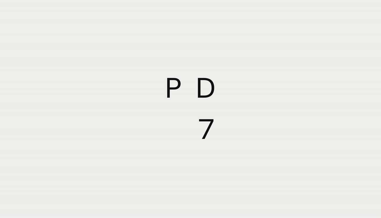 A few large letters on light grey moving toward the corners as a portrait image grows in the center.