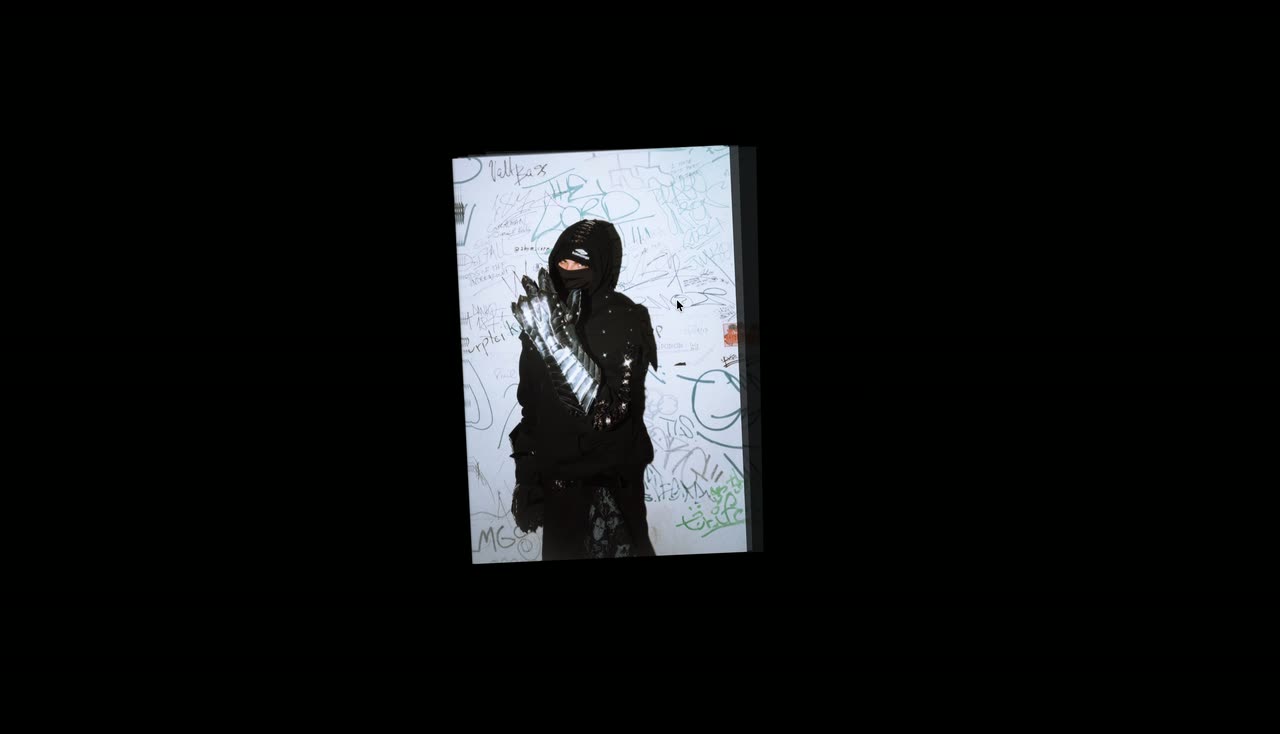 A single portrait card on black that swings and rotates as the cursor moves.