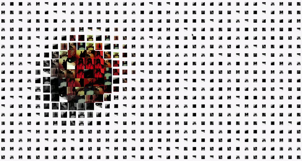 A white field of black squares where circular patches of a colorful image appear at the cursor.